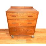A mid 20th century oak chest of drawers