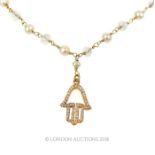 A yellow gold, pearl, labradorite and diamond charm necklace