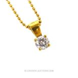 An 18 ct yellow gold, diamond solitaire pendant on an 18 ct yellow gold chain