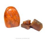 A Chinese amber coloured soapstone carving and a seal