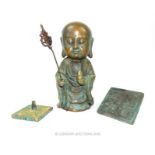A bronze Buddhist figure with two seals
