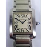 A Cartier stainless steel tank wristwatch.