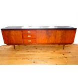 A mid 20th century Greaves and Thomas teak sideboard
