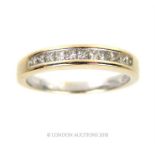 An 18 ct yellow gold, diamond half eternity ring