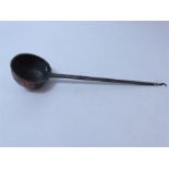 A large antique rustic French copper ladle