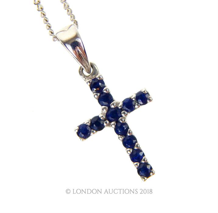 A 9 ct white gold and sapphire cross pendant on a 9 ct white gold chain - Image 2 of 2