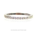 An 18 ct white gold and diamond eternity ring