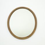 An Edwardian oval walnut wall mirror