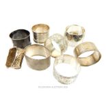 Eight English sterling silver napkin rings