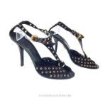 A pair of Gucci, black suede and gilt eyelet heels (Size: 39 1/2)