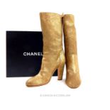 A boxed, pair of Chanel, gold-tone leather, high-heeled boots (Size: 37)