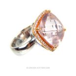 An 18 ct white gold, large faceted pink stone ring with diamonds