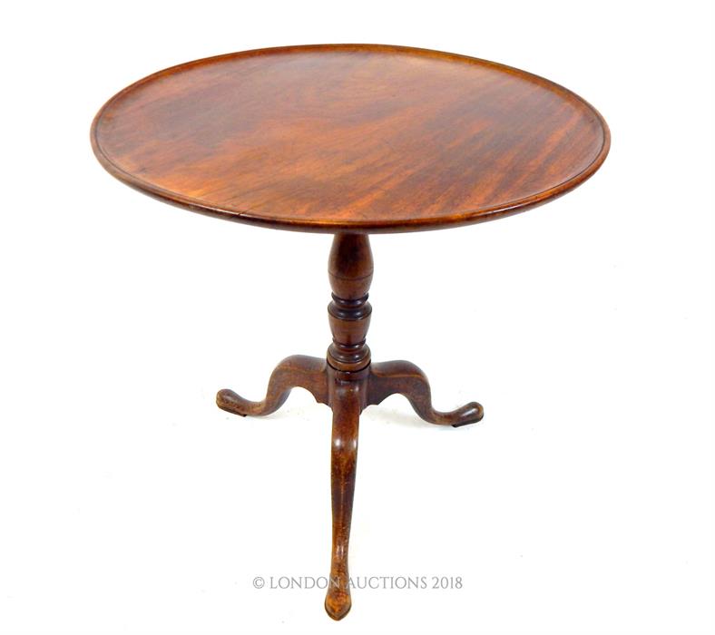 A 19th century, circular, mahogany tilt-top table