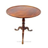 A 19th century, circular, mahogany tilt-top table