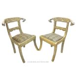 A pair of Eastern, white metal-encased chairs