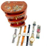Seven watches with a wooden mother of pearl jewellery box