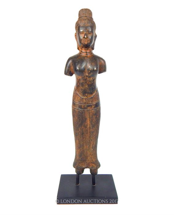 A Balinese cast bronze female figure, raised on a black presentation stand