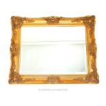 Gilt wall mirror with bevelled plate