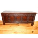 A large antique oak coffer