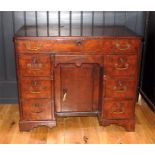 A Georgian mahogany kneehole desk