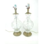 A pair of press moulded glass table lamps