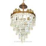 Five tier gilt metal and crystal chandelier