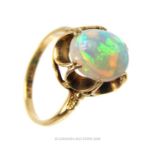 An antique, 9 ct yellow gold, claw-set, natural opal ring