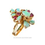 A yellow gold opal and ruby ring. Condition: good. Size: N. 5 g.