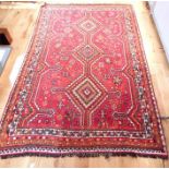 A Persian hand made wool rug