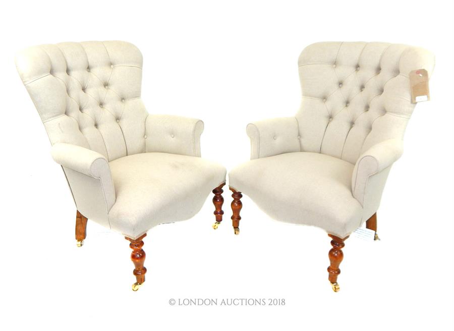 A pair of contemporary Victorian style button back linen upholstered armchairs