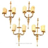Four twin branch gilded brass wall lamps