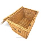 A large, vintage, wicker trunk