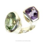 A substantial, sterling silver ring set with a green and purple amethyst