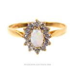 A 9 ct yellow gold, opal and white sapphire cluster ring