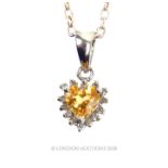 A 14 ct white gold citrine and diamond pendant on chain