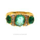 An antique, 18 ct yellow gold, diamond and emerald ring
