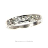 An 18ct white gold diamond half eternity ring. 50 Points. Condition: good. Size: N