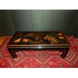 A Chinese black lacquered rectangular low table