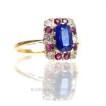 A yellow gold, sapphire, diamond and ruby cluster ring
