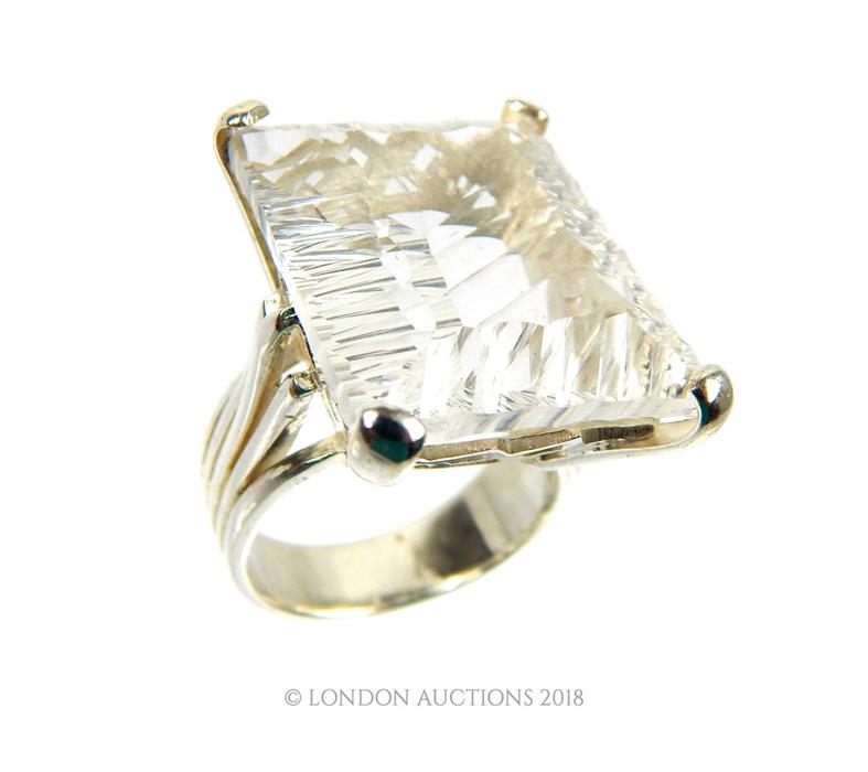 A substantial, sterling silver and faceted rock crystal ring