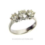 An 18 ct white gold, graduated, 3-stone, diamond ring (1.4 carats total)