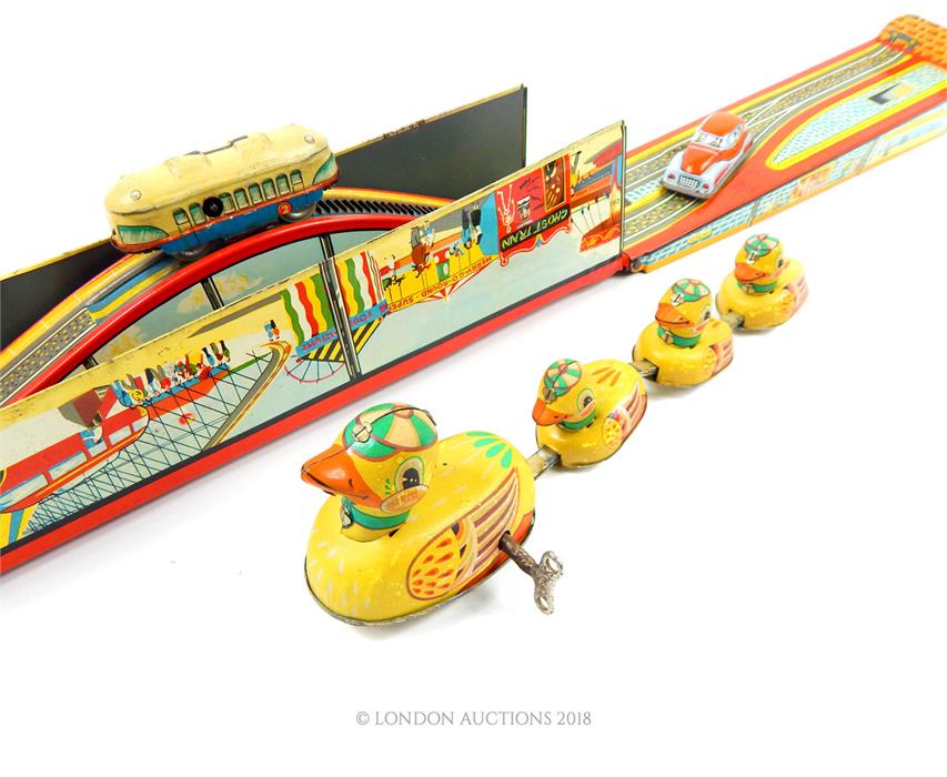 Vintage, tin plated toys to include a line of ducks by Schuco