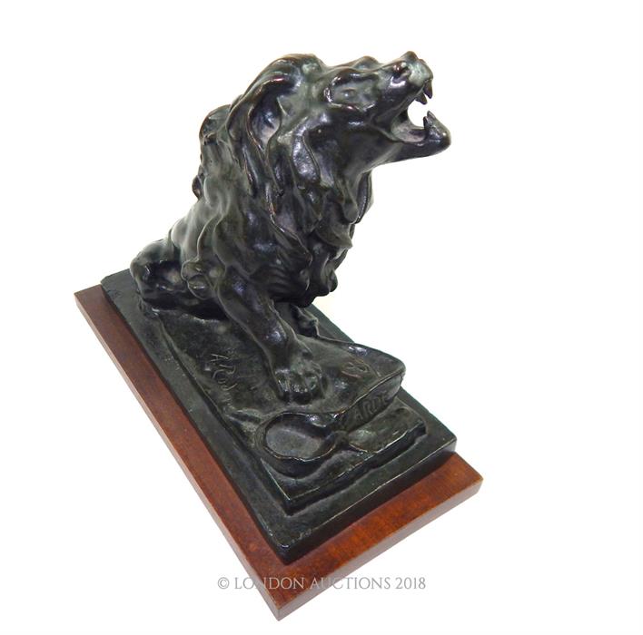 A bronze lion on wooden base, after Auguste Rodin - Image 2 of 4