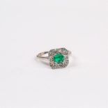 An 18 ct white gold, Art Deco style, emerald and diamond ring