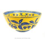 A Chinese famille jaune bowl with blue floral design and six Chinese character seal to base.
