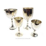 Four silver plated chalices and goblets, the largest 25.5cm high.