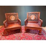 A pair of circa 1900 Chinese rosewood and mother of pearl inlaid chairs