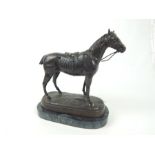A bronze sculpture of a horse