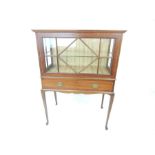 A circa 1920's mahogany and glazed bijouterie cabinet