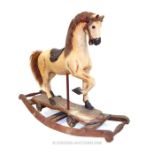 A Victorian carved mahogany rocking horse